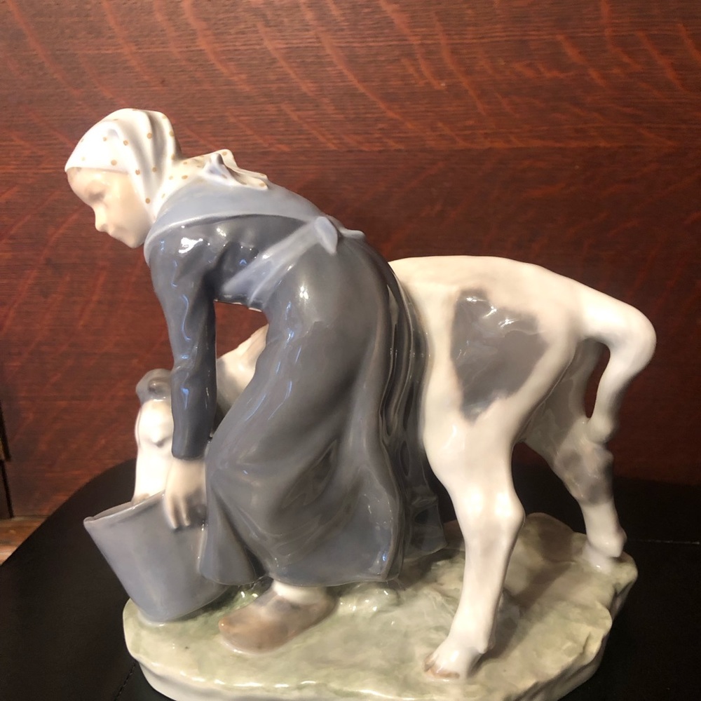 Royal Copenhagen Girl feeding calf #779